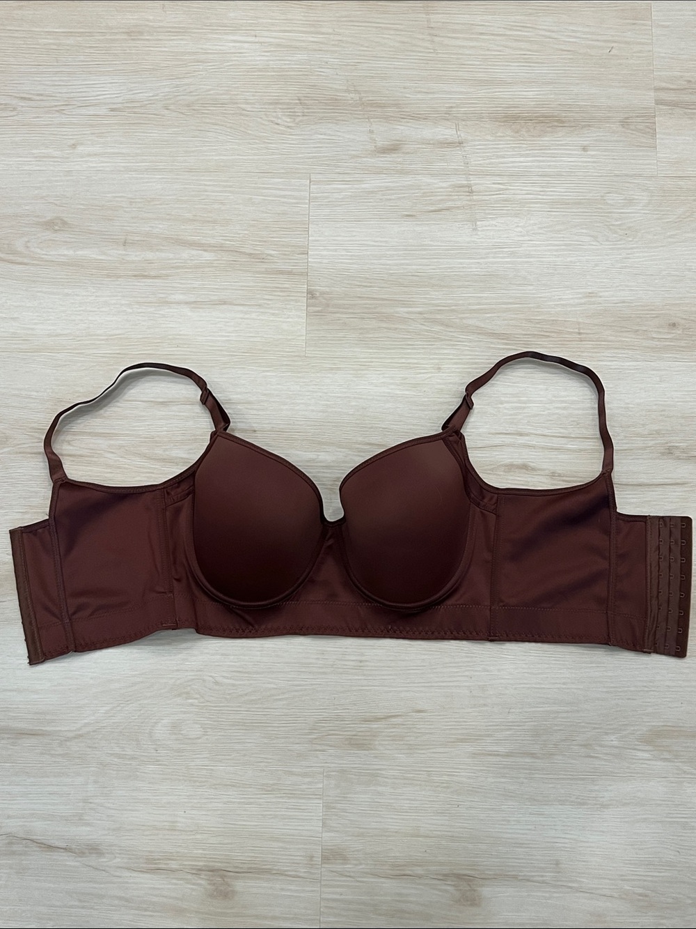 Brown molded-cup underwire bra with wide side wings 36F